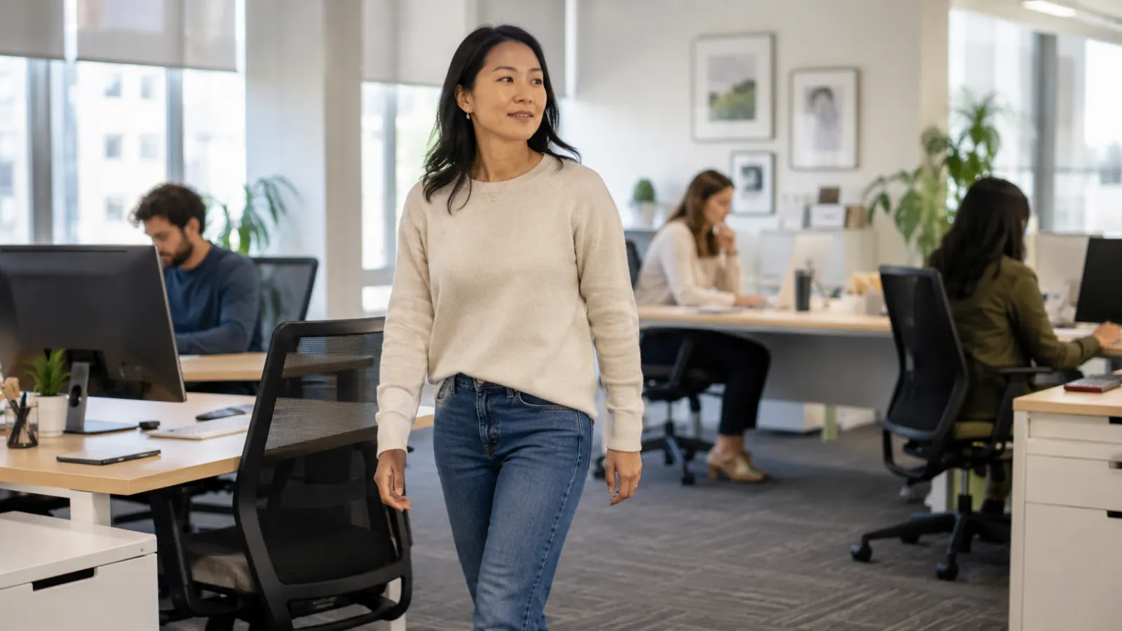 Office worker interrupting desk time with a short walk during the workday